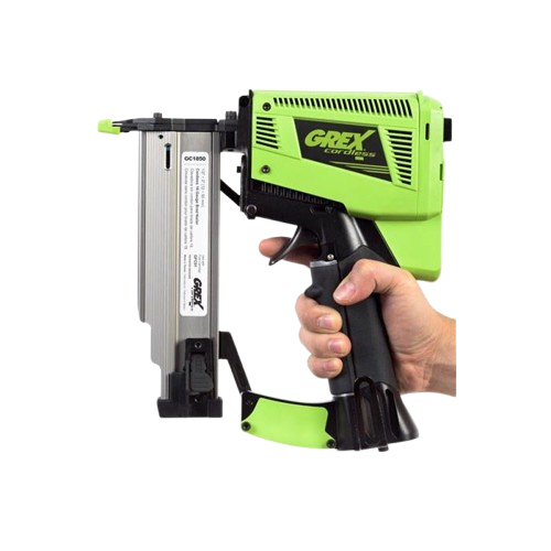 Hand gripping bright green cordless brad nailer designed for precise home improvement and woodworking tasks