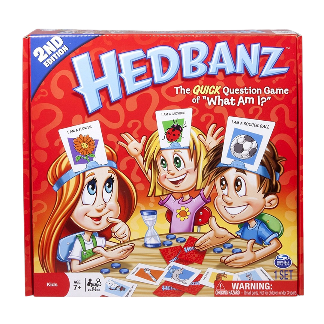 Colorful Hedbanz kids' guessing game box showing cartoon children wearing headbands with image cards and game pieces on table