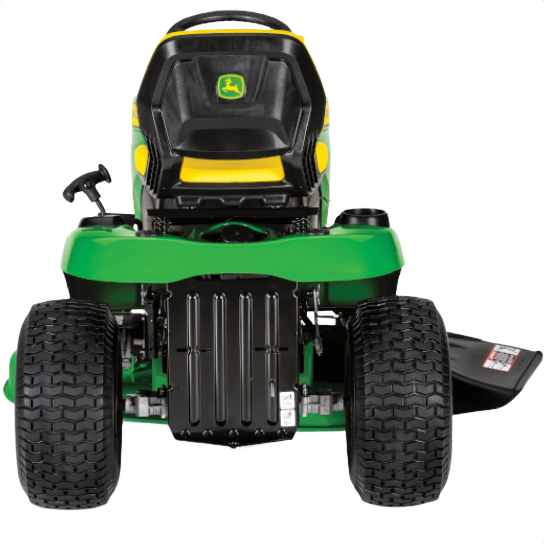 Rear view of green and yellow riding lawn tractor with large tread tires and 42-inch cutting deck for home improvement use