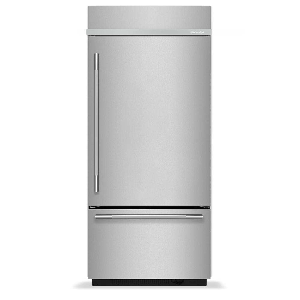 Built-in bottom mount refrigerator with stainless steel finish and sleek handles in KitchenAid appliances collection