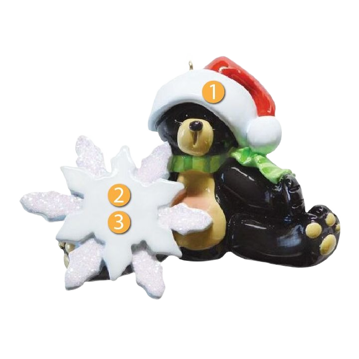 Sitting black bear ornament wearing Santa hat and green scarf holding white glittery snowflake for Christmas decor under $50 collection