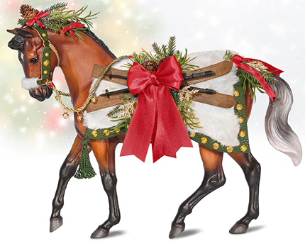 Bay warmblood horse figurine decorated with faux fur blanket, leather straps, pine sprigs, and red holiday bows in toys collection under 100