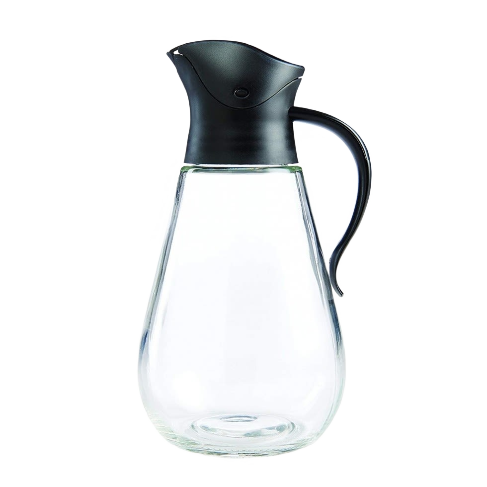 Clear glass syrup dispenser with black plastic lid and ergonomic handle for kitchen use and serving beverages