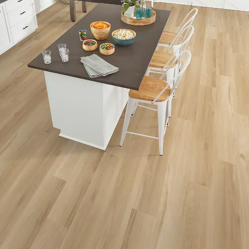 Light natural wood-look vinyl flooring planks from Mohawk Solid Tech LVT collection for durable home improvement projects