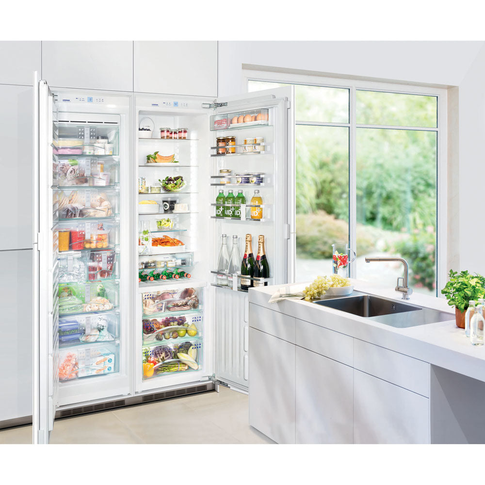 Built-in freezer with ice maker and left hinge open in bright kitchen from Freezers & Ice Makers collection