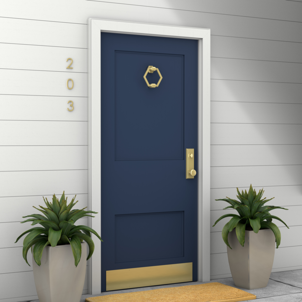 Navy blue door with brushed gold hexagonal door knocker and matching hardware in door accessories and home improvement collection