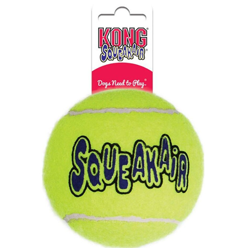 Large bright yellow squeaky dog toy ball with durable tennis ball texture and packaging tag visible above it