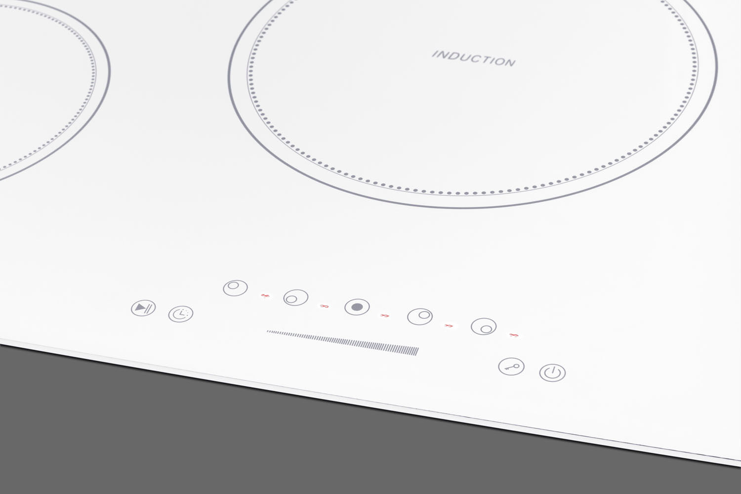 Close-up of white induction cooktop with five cooking zones and touch control panel in appliances collection