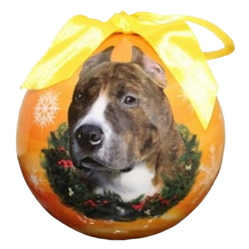 Christmas ball ornament featuring a brindle and white pit bull dog with a festive wreath and yellow ribbon bow