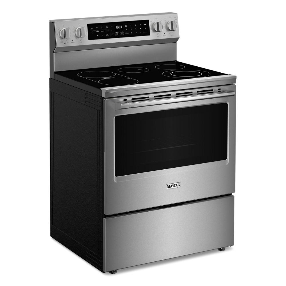 Electric range with stainless steel finish, smooth glass cooktop, control panel, and large oven window in kitchen appliances collection