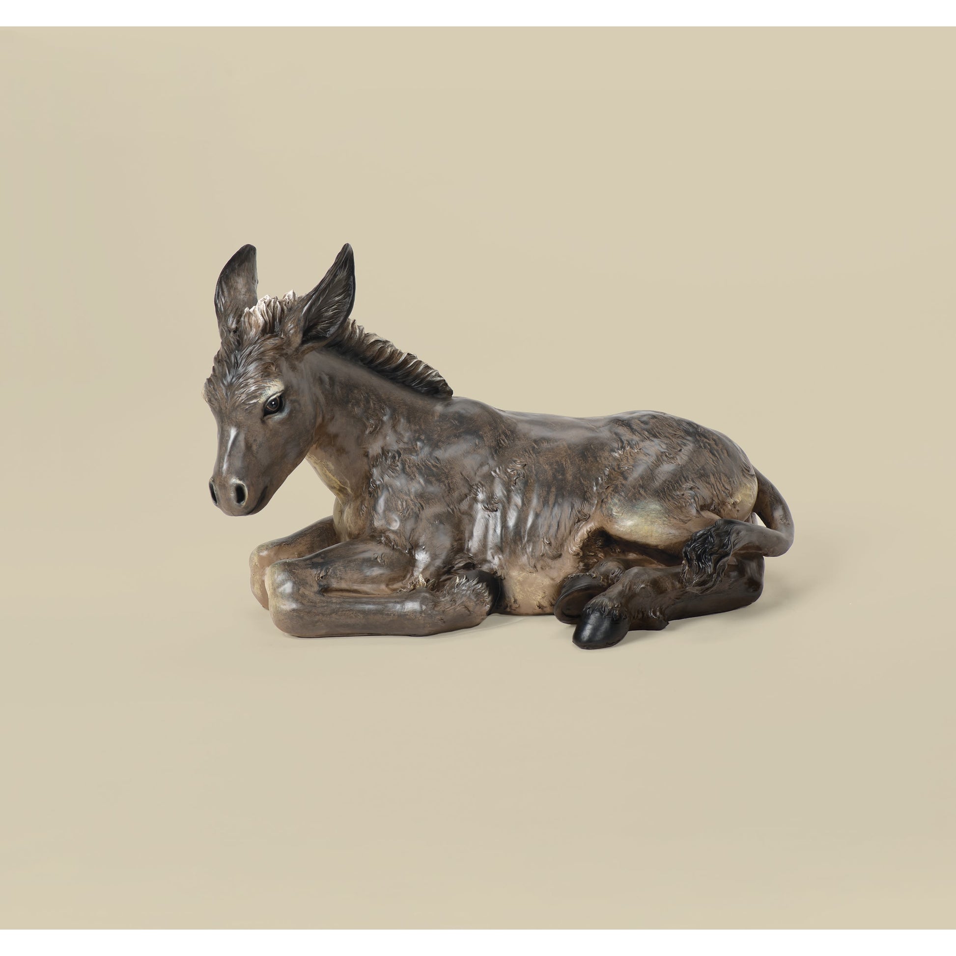 Detailed figurine of a resting donkey in muted brown tones for Christmas Nativity Scenes collection