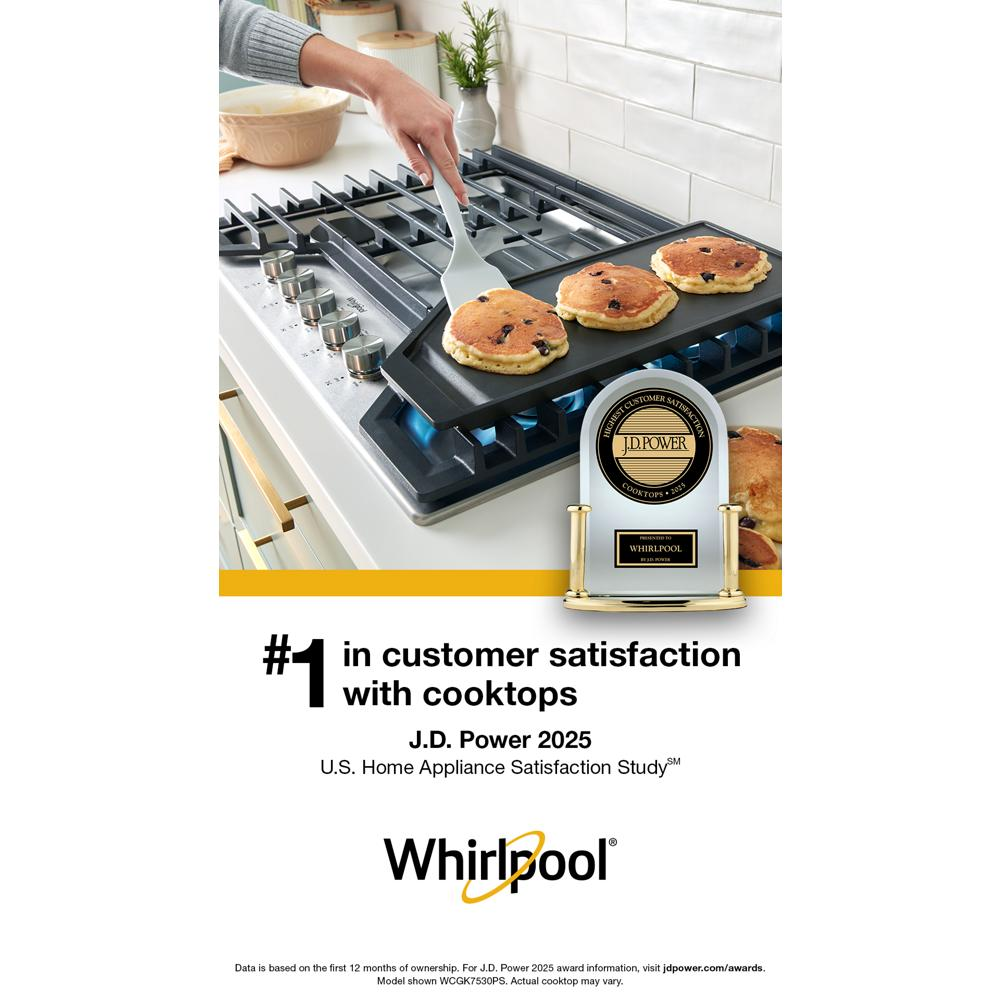Blue flame heating griddle on a stainless steel gas cooktop with hinged cast-iron grates from Kitchen & Kitchenware collection