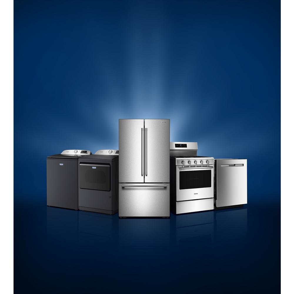 Modern stainless steel kitchen appliances set including refrigerator, gas range, dishwasher, and matching washers and dryers