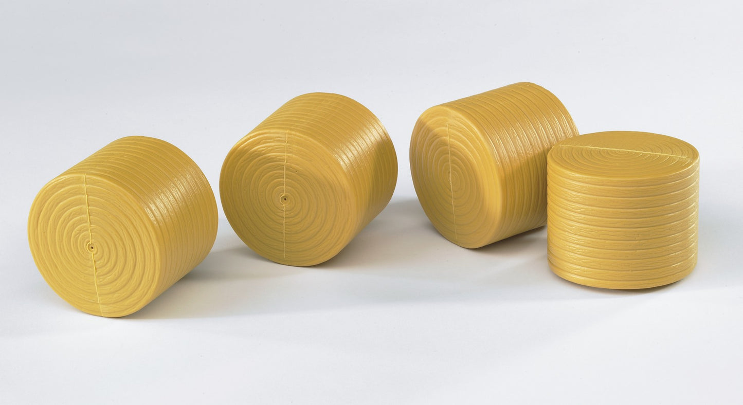 Four yellow plastic round bales designed as miniature accessories compatible with Bruder Claas Rollant 250 models