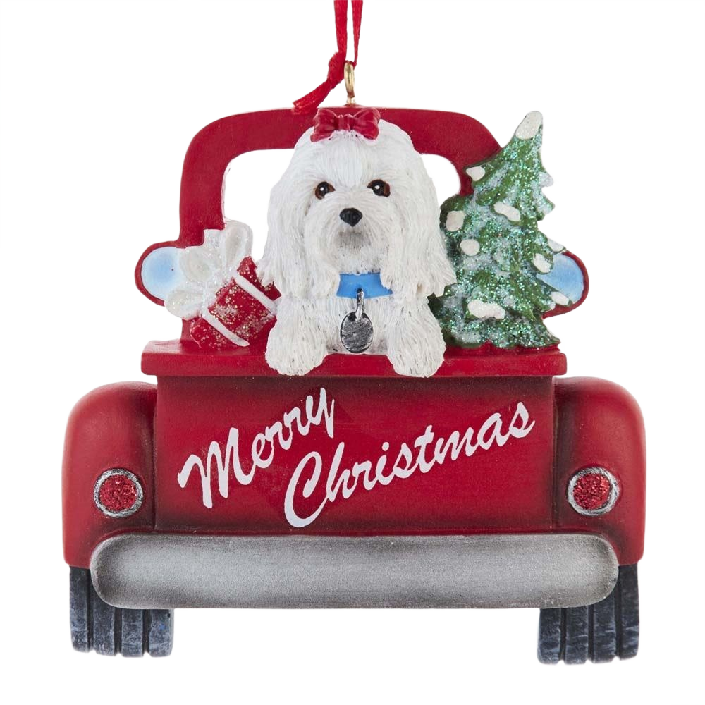Red truck ornament with a white Maltese dog wearing a bow, carrying a Christmas tree and a gift box