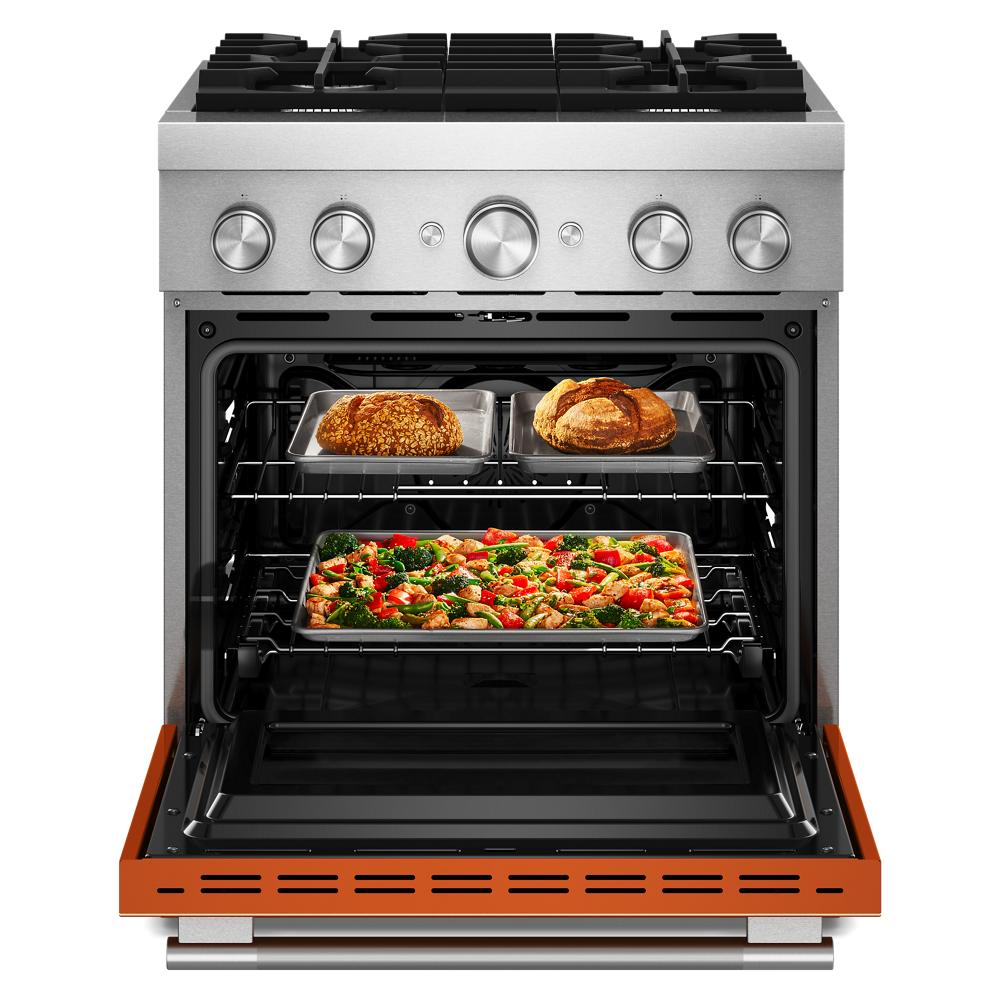Open stainless steel oven with air fry mode baking vegetables and bread inside in modern kitchen appliance setting