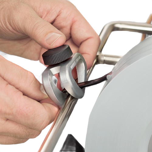 Hand adjusting a Tormek SVS-38 short tool jig sharpening a blade on a wet grinding wheel for home improvement tasks