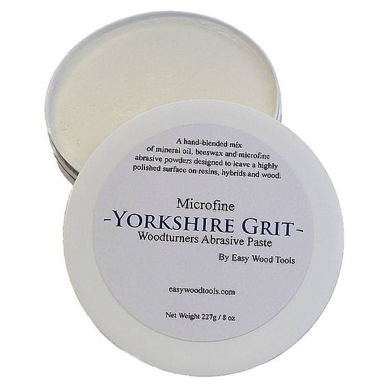Open container of microfine abrasive paste for woodworking finishing and polishing in home improvement tools collection