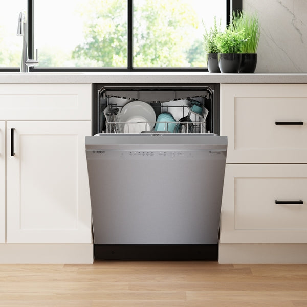 Built-in 24-inch stainless steel dishwasher with anti-fingerprint finish, open and loaded with clean dishes in kitchen setting