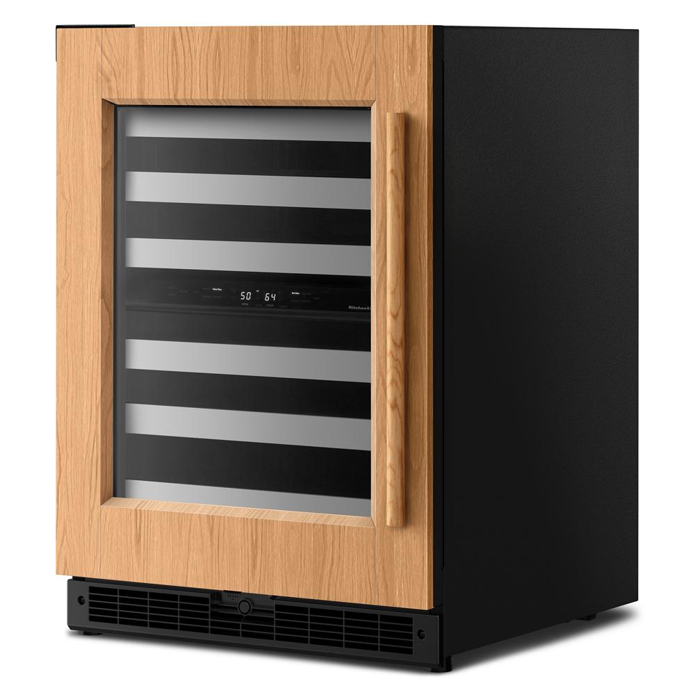 undercounter wine cellar with wood panel door and glass front featuring metal racks in KitchenAid appliances collection