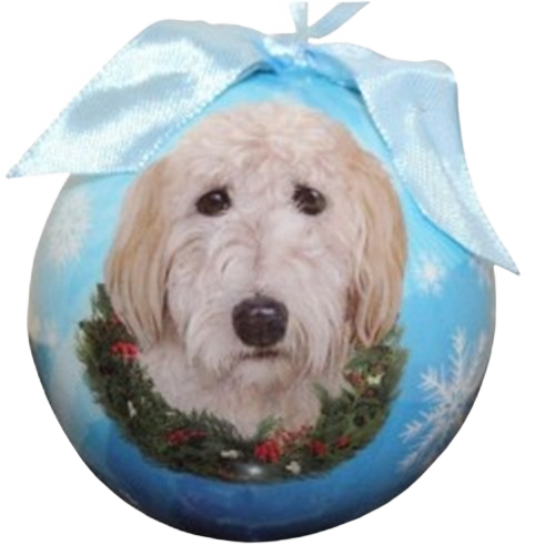 Round Christmas ornament featuring a Goldendoodle dog portrait with a holiday wreath and light blue ribbon bow