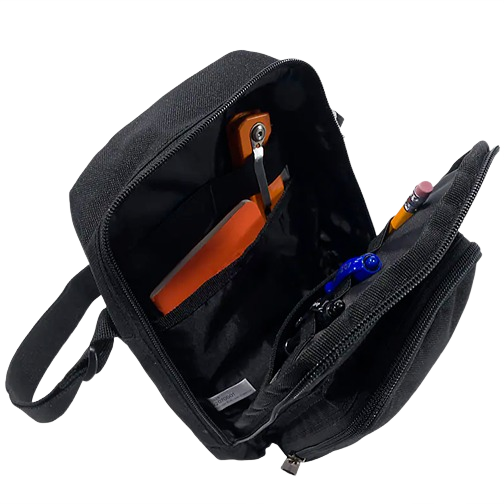 Black Carhartt zip bag with organized compartments holding a phone, pens, and pencils for everyday use.