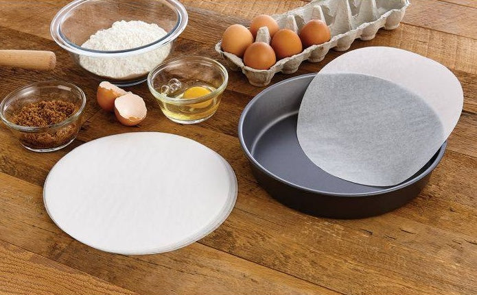 Round parchment paper sheets for baking, sized to fit 8-inch pans, part of kitchenware and bakeware essentials under $25