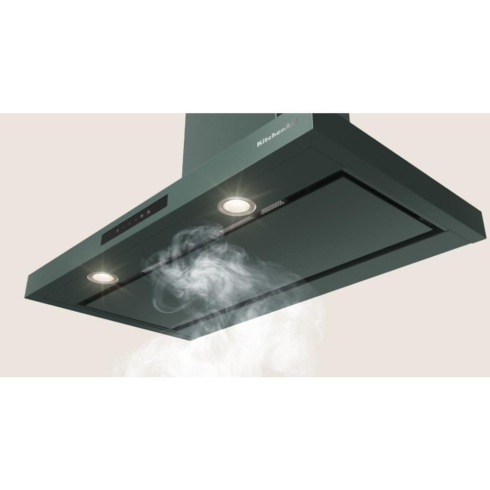 Matte dark green wall-mount canopy hood with built-in lights and smoke extraction from KitchenAid range hoods collection