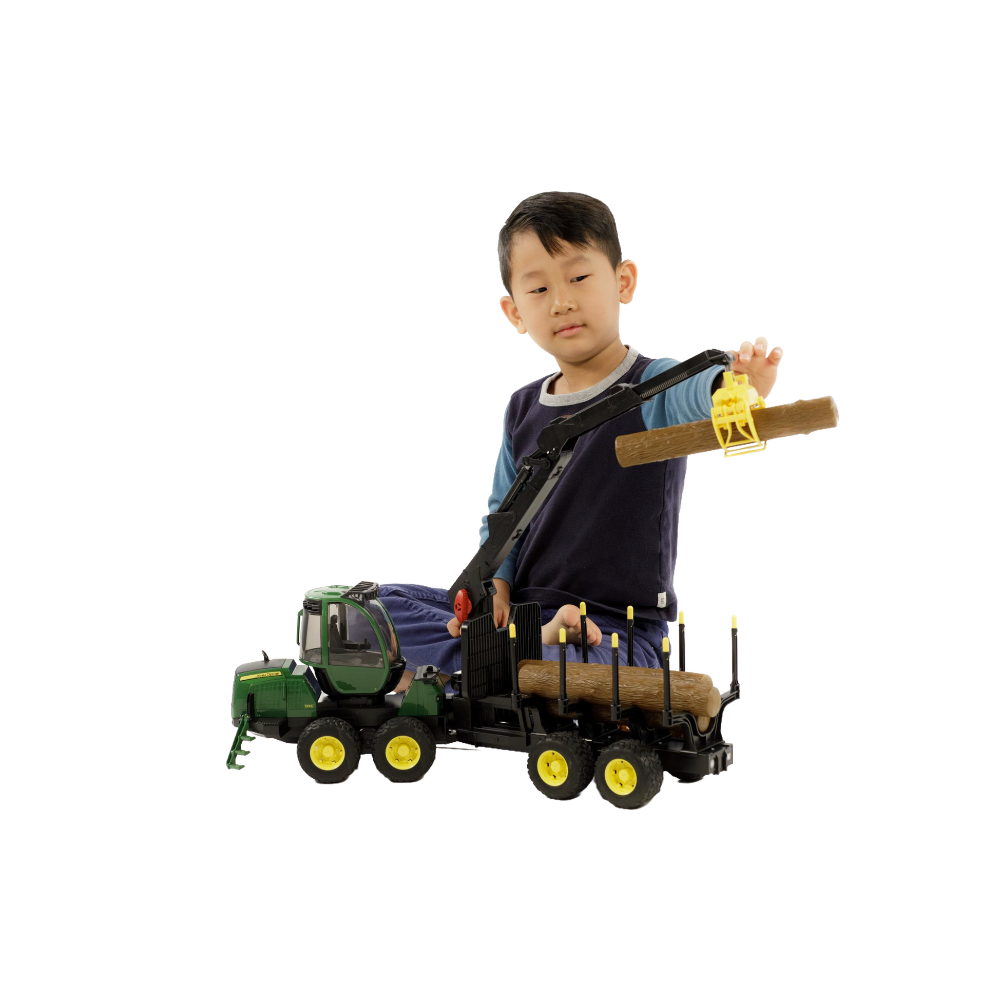 Child playing with green and yellow Bruder John Deere forwarder toy lifting a wooden log in Toys & Games under $100 collection