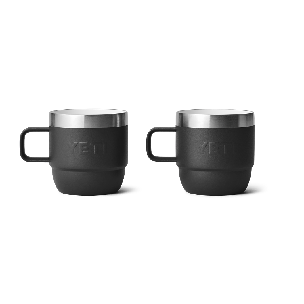 Two black stackable mugs with stainless steel rims designed for rugged use in kitchen and outdoor drinkware collections