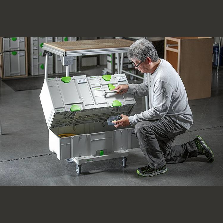Person organizing modular tool storage boxes on a wheeled SYS-Cart for workshop tool storage and organization