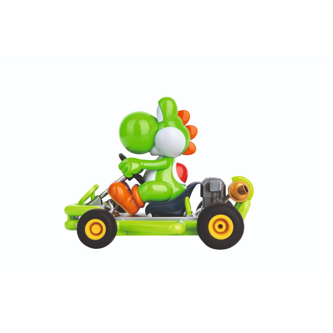 Green Yoshi character seated in a bright green pipe kart racer toy with black wheels and orange accents