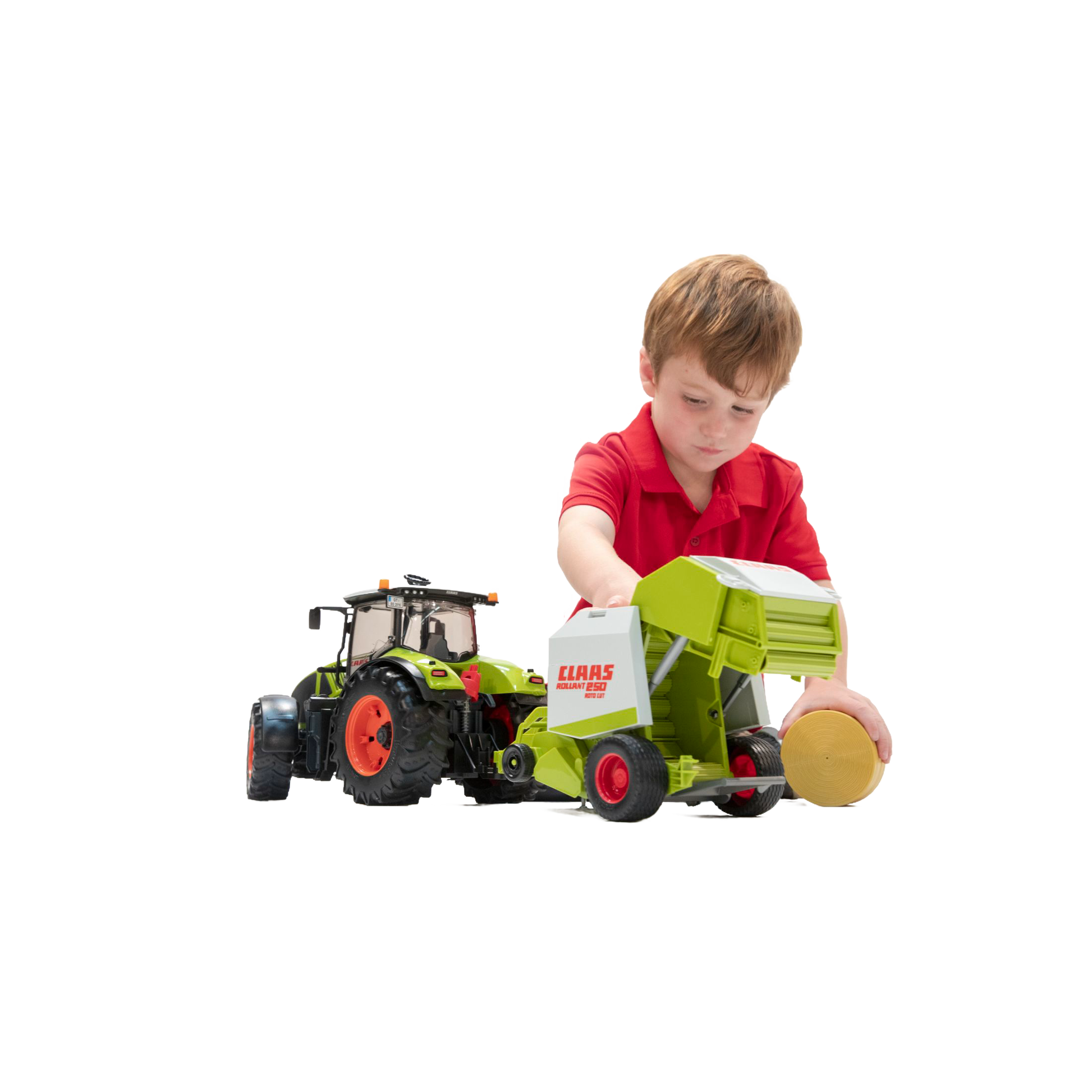 Young boy playing with Bruder Claas Rollant 250 Round Baler toy from Vehicles & Remote Controlled Toys collection