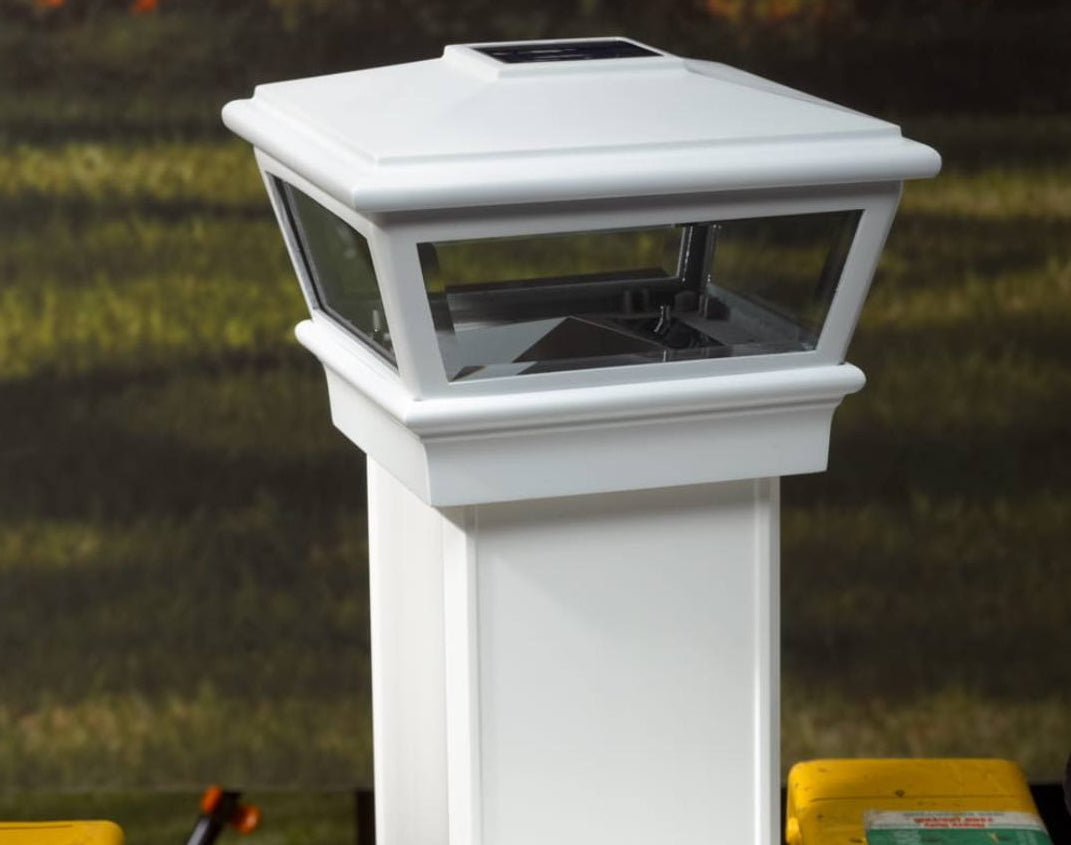 White solar-powered deck post cap with traditional design for energy-efficient outdoor home improvement lighting