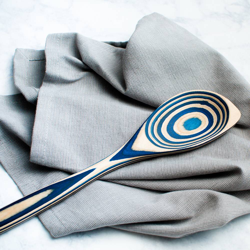 Twelve-inch pakkawood corner spoon with a vibrant blue swirl pattern, ideal for Kitchenware and Kitchen Utensils collections under $50.