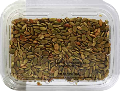 Clear plastic container filled with roasted salted shelled pumpkin seeds in snacks and food collection