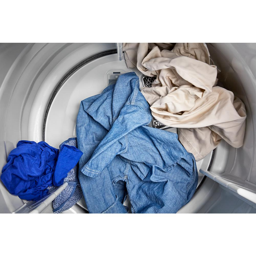 Inside view of a top load gas dryer with mixed fabrics in blue and beige from Dryers and Appliances collections