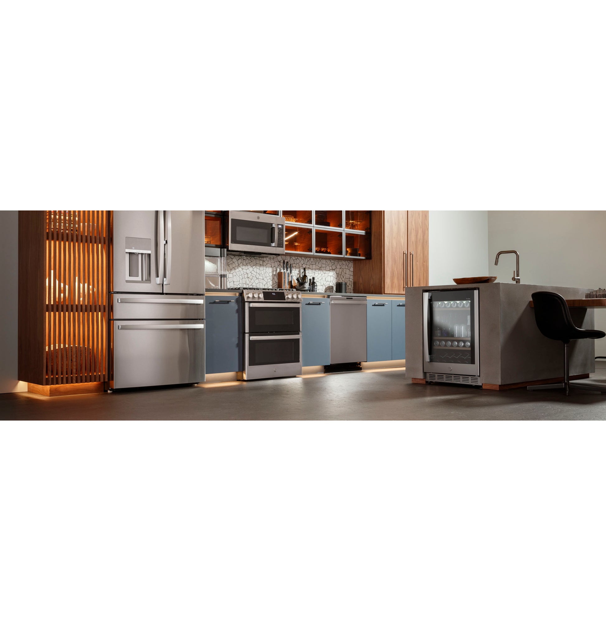 Modern kitchen with blue lower cabinets, wood upper shelves, stainless steel fridge, dishwasher, and gas slide-in range from Ranges collection