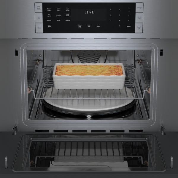 Stainless steel built-in speed oven with digital control panel cooking casserole dish in Bosch Appliances collection