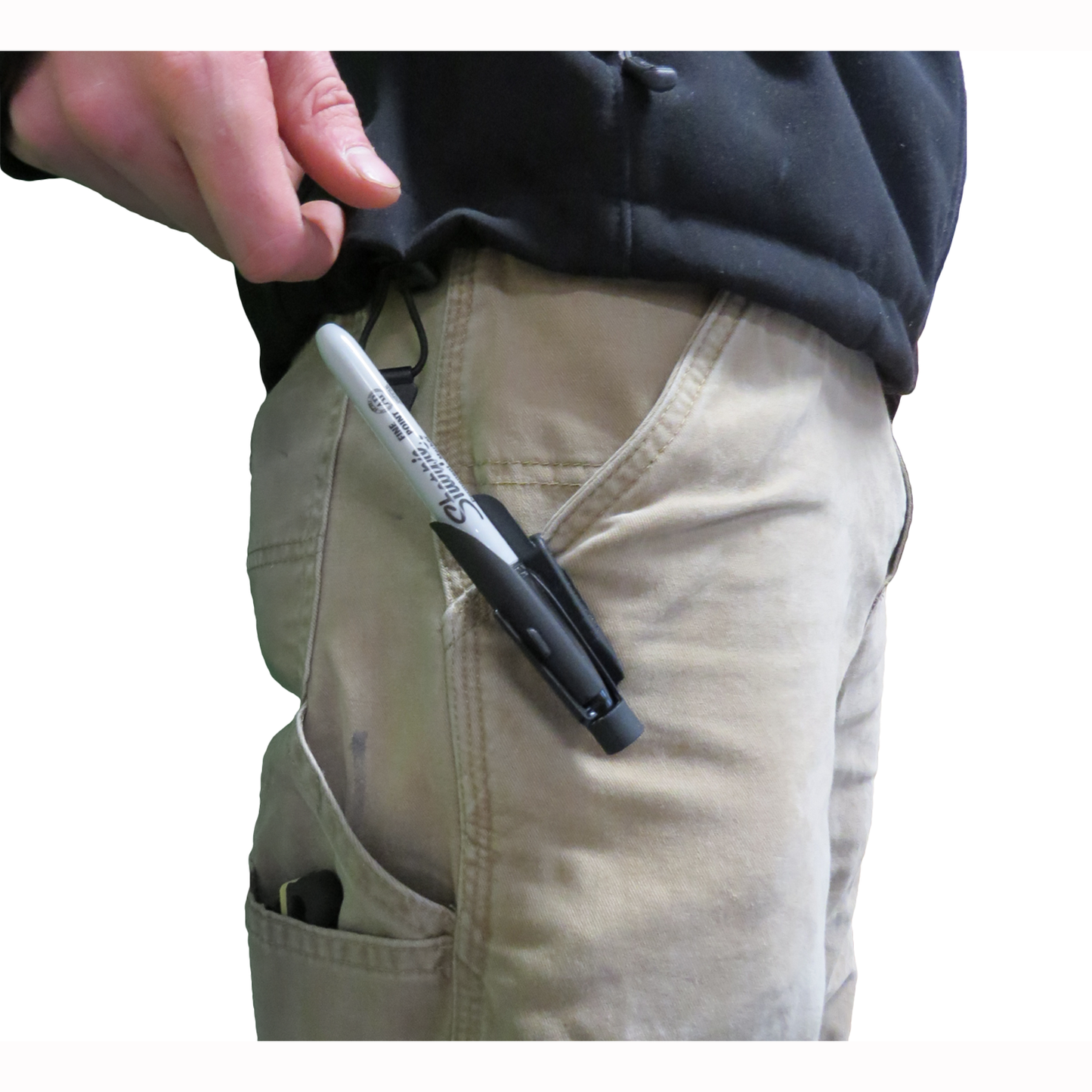 Black clip-on holster with silver marker attached to beige work pants pocket for woodworking and hand tools collection