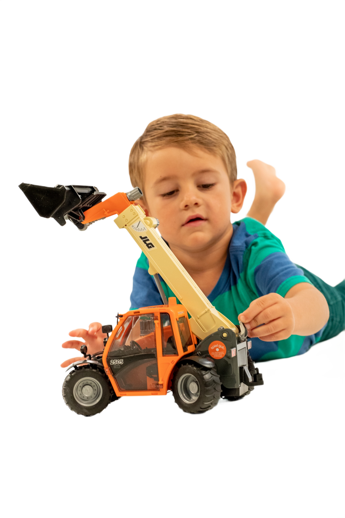 Young child playing with detailed orange and beige Bruder JLG 2505 telehandler toy for home improvement imaginative play