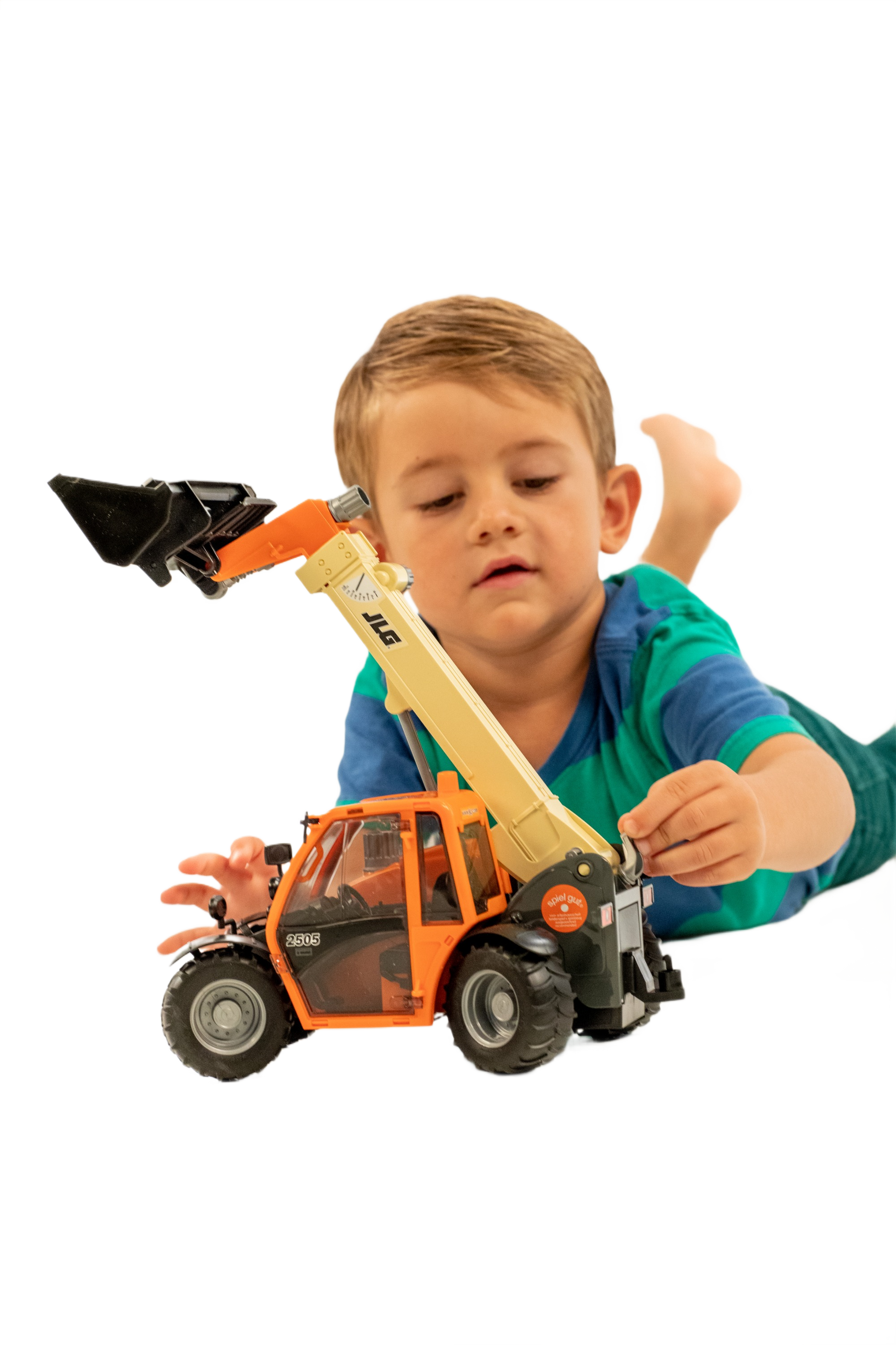 Young child playing with detailed orange and beige Bruder JLG 2505 telehandler toy for home improvement imaginative play