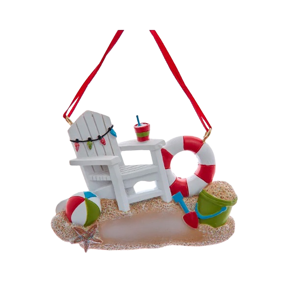 White beach chair Christmas ornament with colorful beach ball, bucket, shovel, and red life preserver decoration