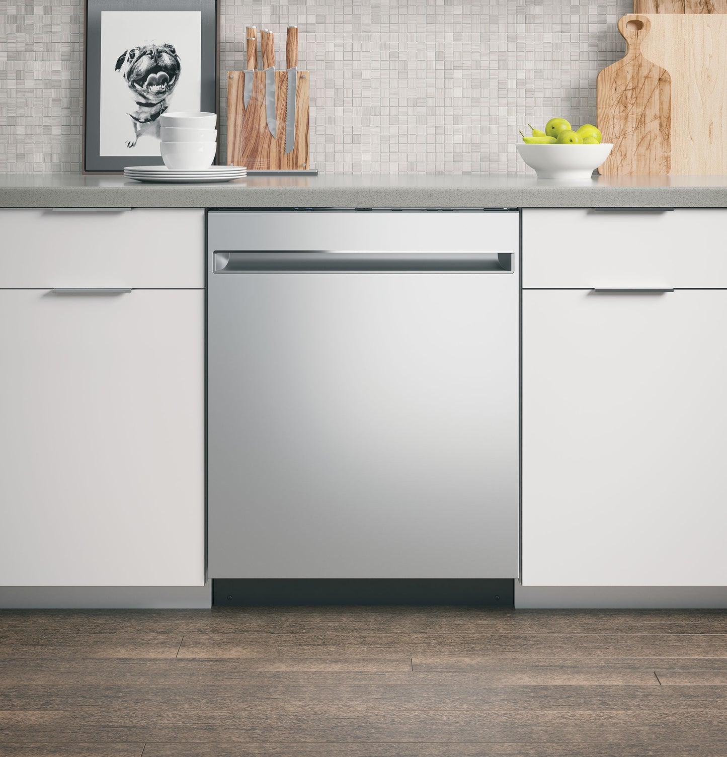 Built-in stainless steel dishwasher with sleek handle in modern kitchen featuring white cabinetry and wood flooring