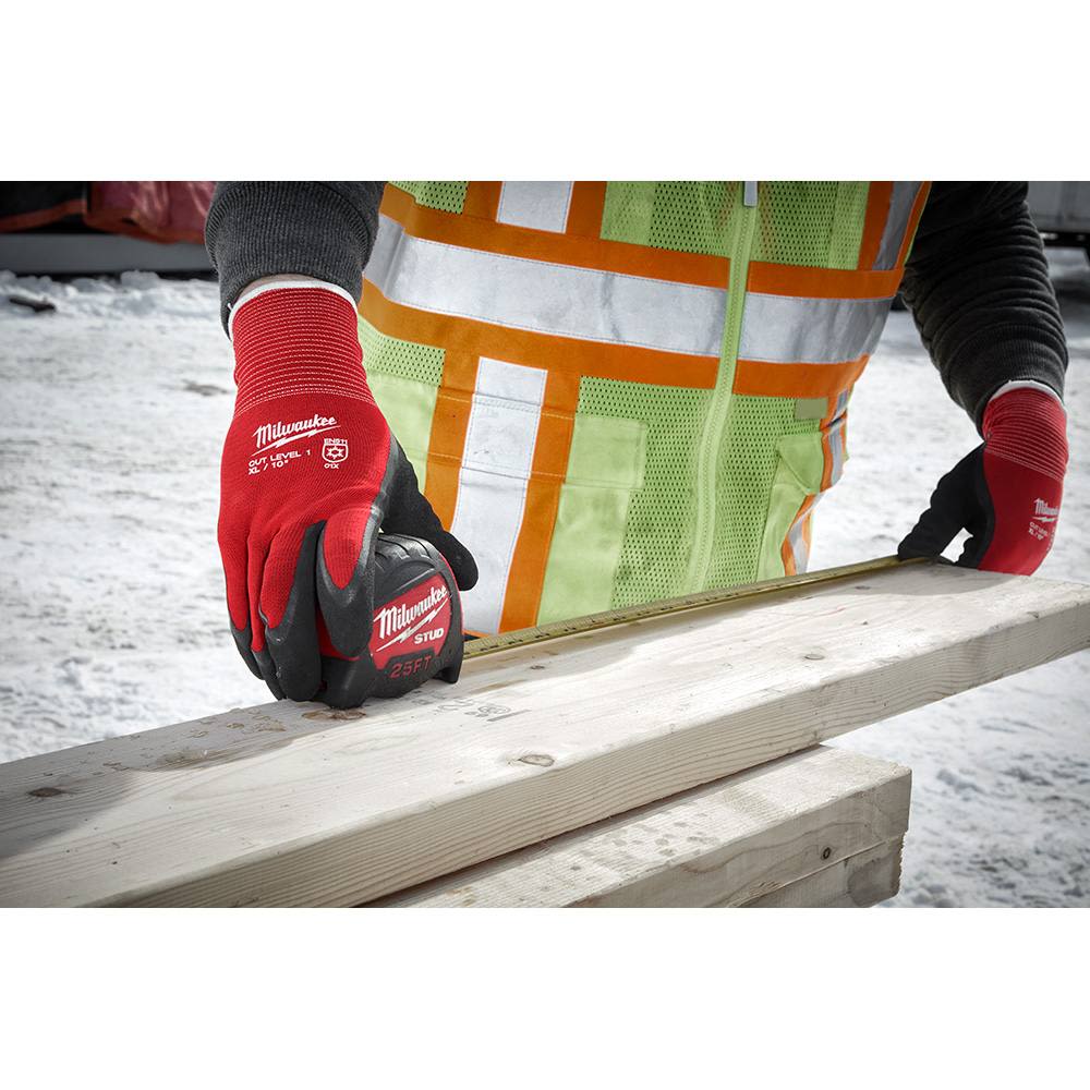 Red and black winter dipped gloves with cut level 1 protection measuring wood for construction safety and home improvement tasks