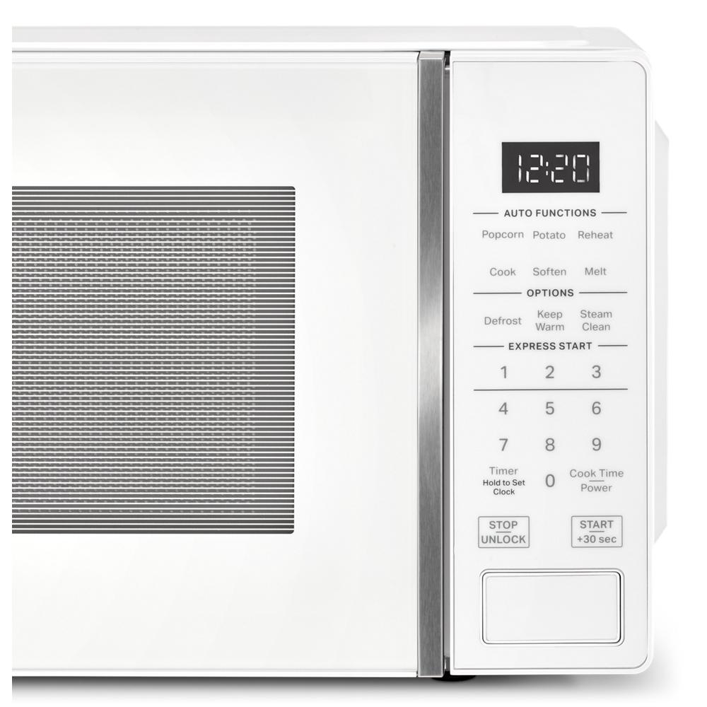 White countertop microwave with electronic controls, LED display, and preset cooking functions from kitchen appliances collection