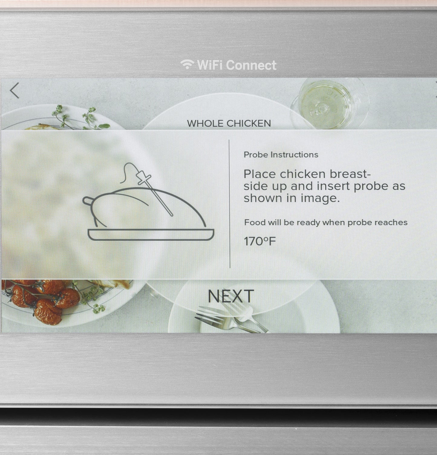 Touchscreen display on smart wall oven showing whole chicken probe instructions with WiFi connect symbol