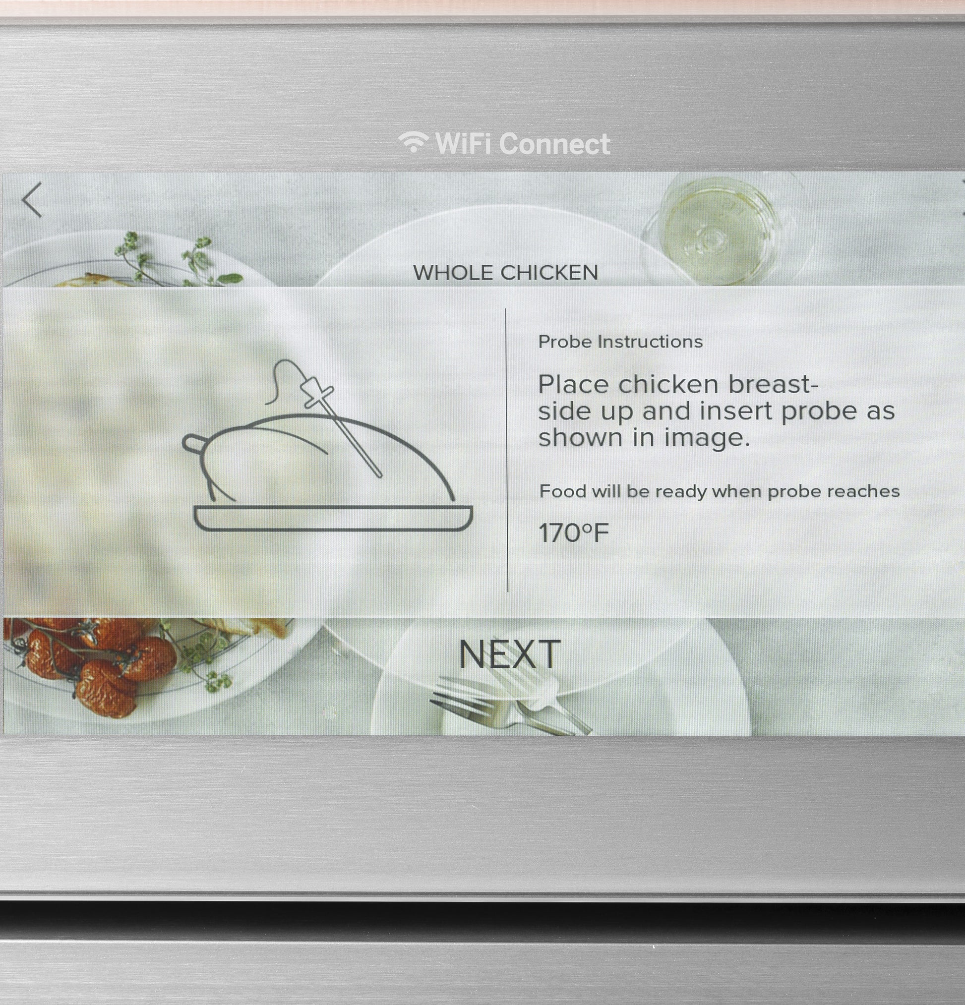 Touchscreen display on smart wall oven showing whole chicken probe instructions with WiFi connect symbol