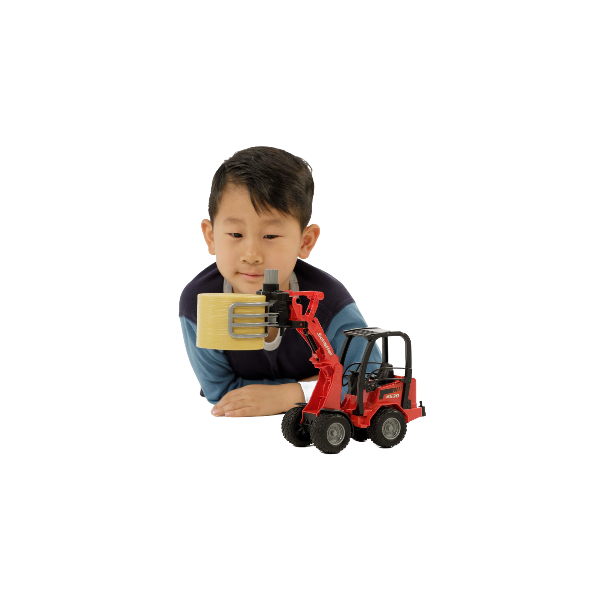 Child playing with red compact loader toy lifting round bale in Vehicles & Remote Controlled Toys collection