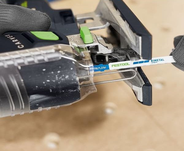 Close-up of Festool jigsaw inserting a bimetal blade in woodworking tool accessory for precise cutting tasks